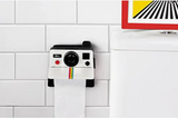 Polaroll porta papel higiénico